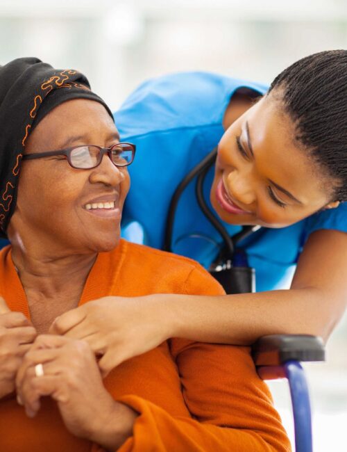 happy senior patient with friendly female nurse